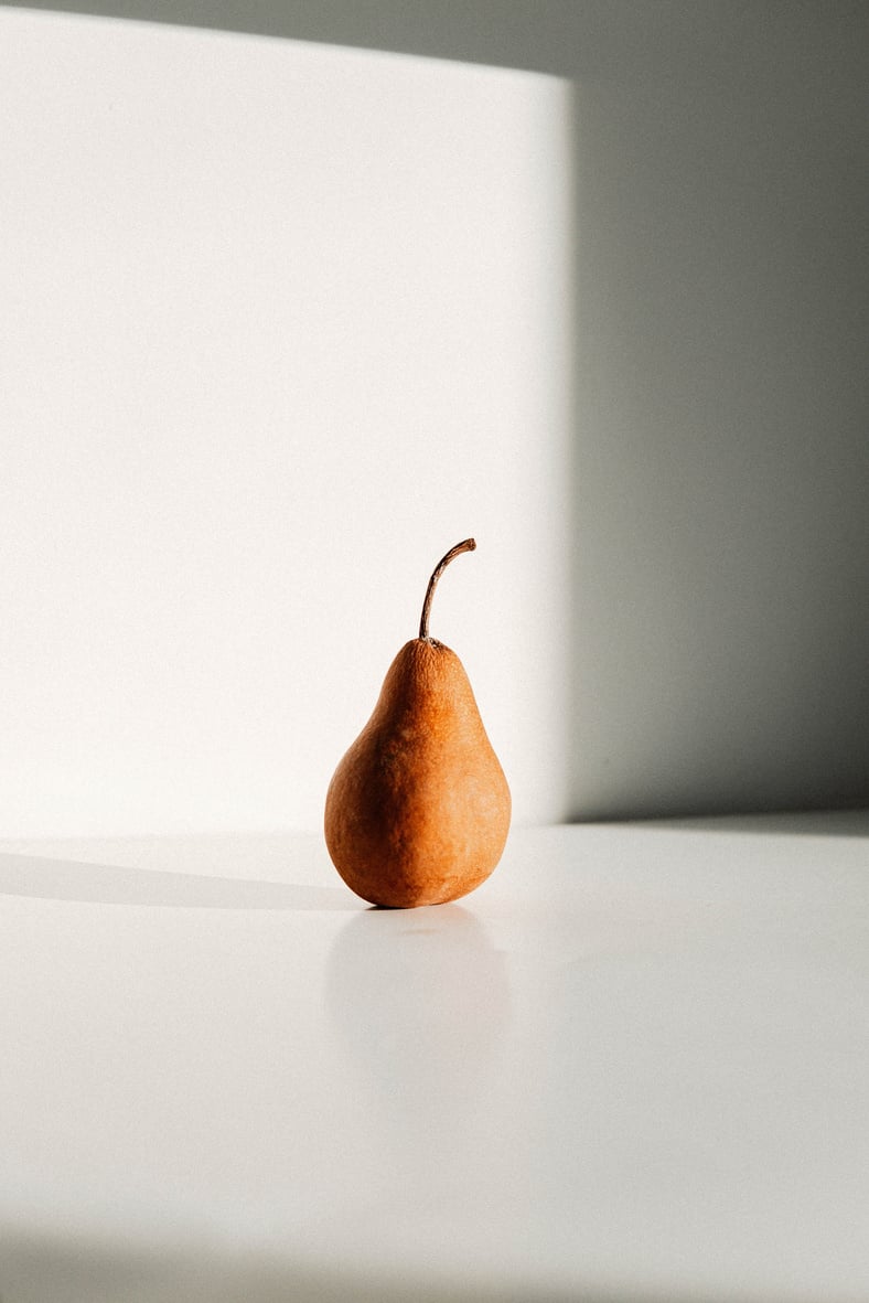 Brown Fruit on White Table